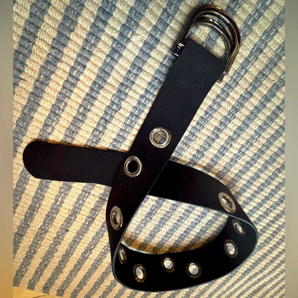 Women’s black suede belt with silver grommets. Size Small